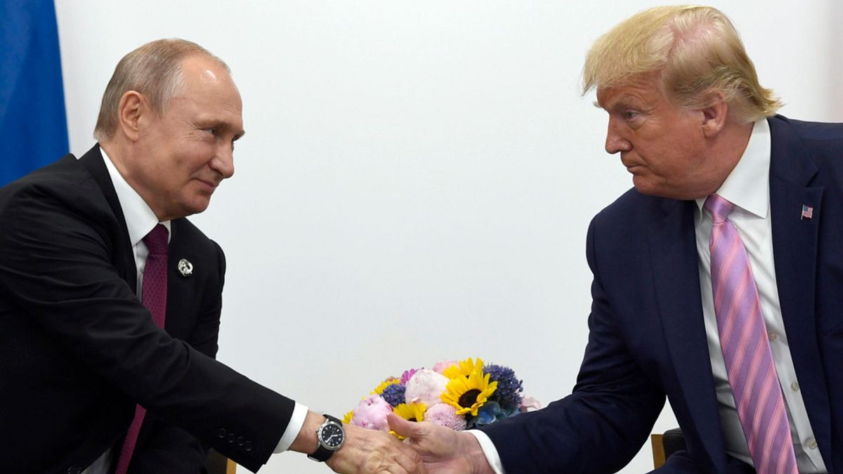 FILE - In this June 28, 2019, file photo, President Donald Trump, right, shakes hands with Russian President Vladimir Putin, left, during a bilateral meeting on the sidelines