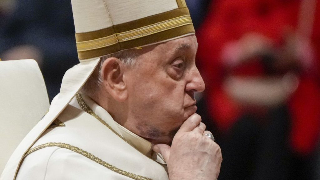 Pope Francis reacts during a solemn mass where he made 21 new cardinals in St. Peter