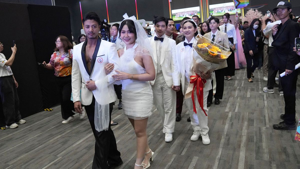 Couples from the LGBTQ+ community parade to a hall after the Marriage Equality Act took effect in Bangkok, Thailand, Thursday, 23 January 2025.