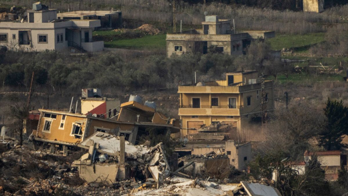 An Israeli tank maneuvers inside a village in southern Lebanon, as seen from northern Israel, Thursday, Jan. 23, 2025.