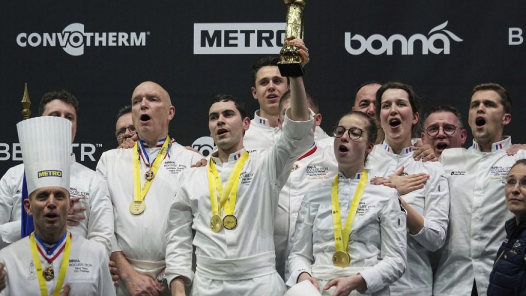 French chef Paul Marcon, center, celebrates with his teammates after winning the final of the "Bocuse d