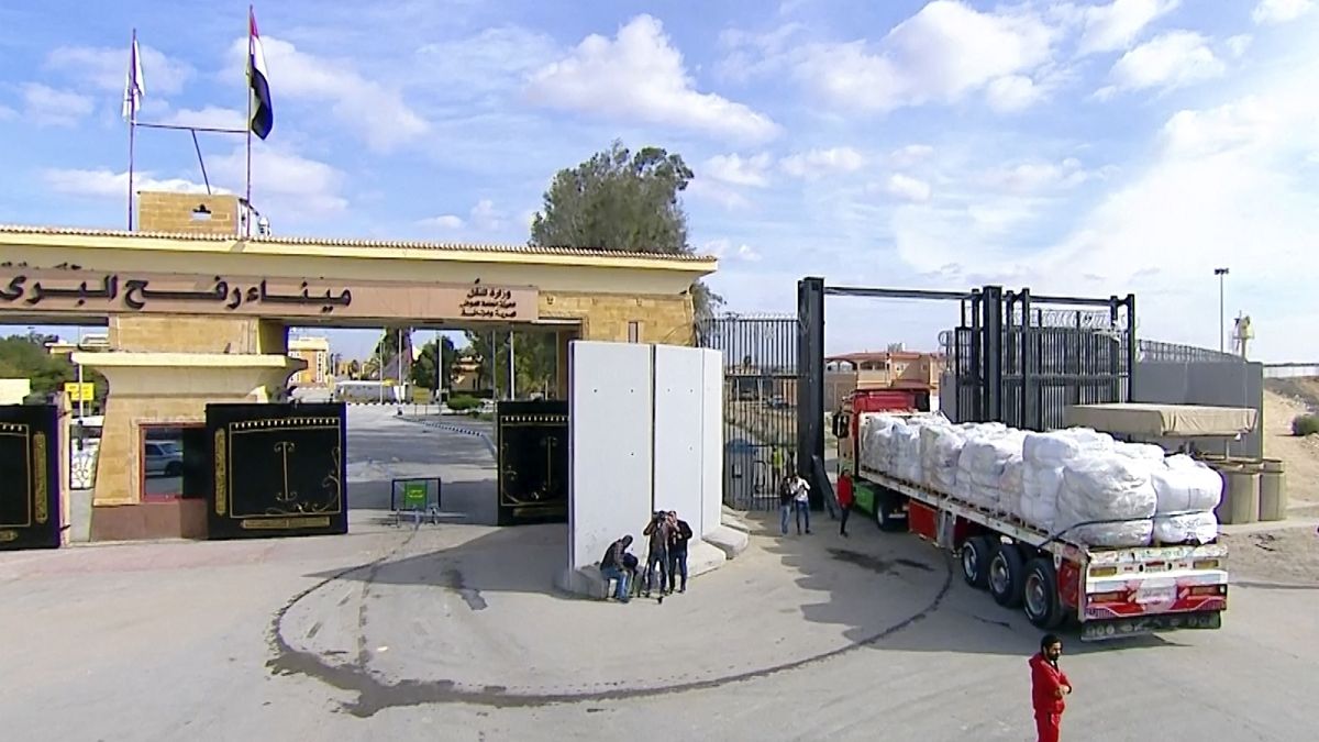 Trucks of aid enter the Gaza Strip through the Rafah crossing in Rafah, Egypt, Sunday January. 19, 2025.