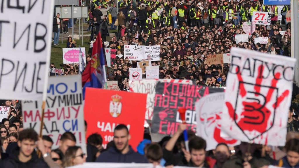 Students march during a student-led 24 hour block on an intersection to protest the deaths of 15 people killed in the November collapse of a train station canopy, in Belgrade,