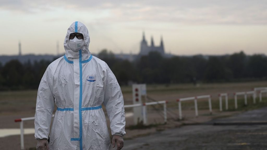 A person in a protective suit is shown in Prague, Czech Republic, in September 2020 amid the COVID-19 pandemic.