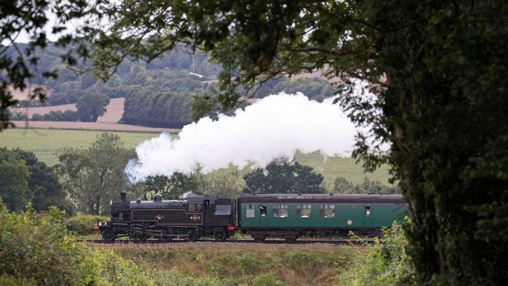 The British Railways Ivatt Class 2MT Tank Engine number 41312, makes its way along the Mid Hants railway, near to Ropley, England, August 2020.