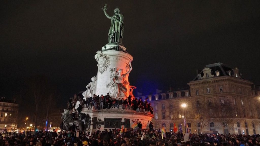 Left-leaning demonstrators celebrate the death of Jean-Marie Le Pen in Paris