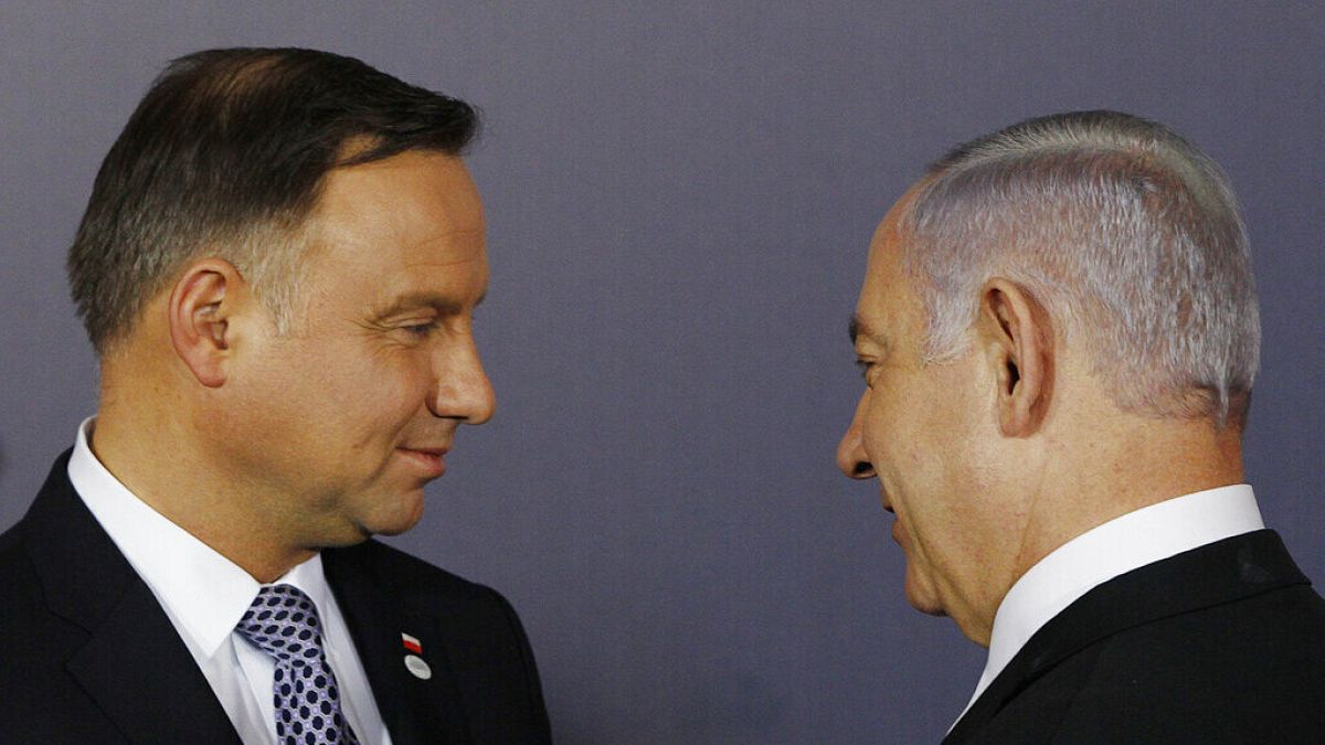 FILE: Polish President Andrzej Duda, left, and Israeli Prime Minister Benjamin Netanyahu, talk during a conference in Warsaw, Poland,  Feb. 13, 2019