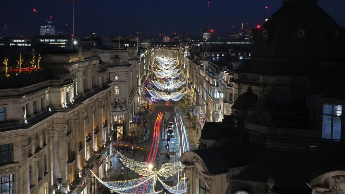 Christmas lights are displayed on Regent Street, in London, Wednesday, Nov. 20, 2024. (AP Photo/Kin Cheung)