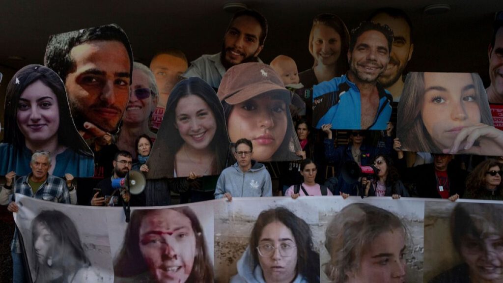 Relatives and supporters of Israeli hostages held by Hamas in Gaza hold photos of their loved ones during a protest calling for their return, in Tel Aviv, Israel, Wednesday,.