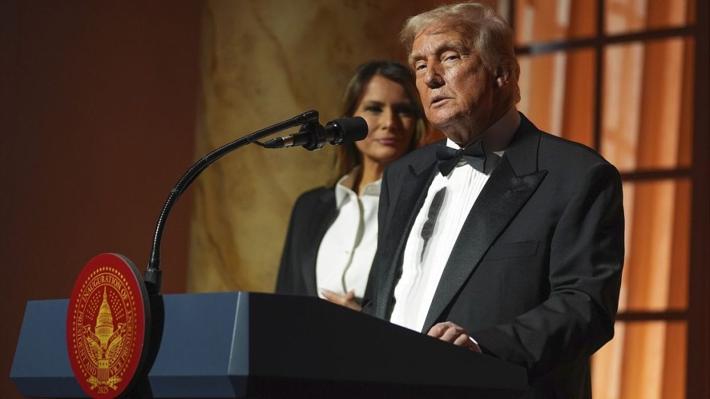 President-elect Donald Trump speaking at a dinner ahead of his inauguration as wife Melania looks on