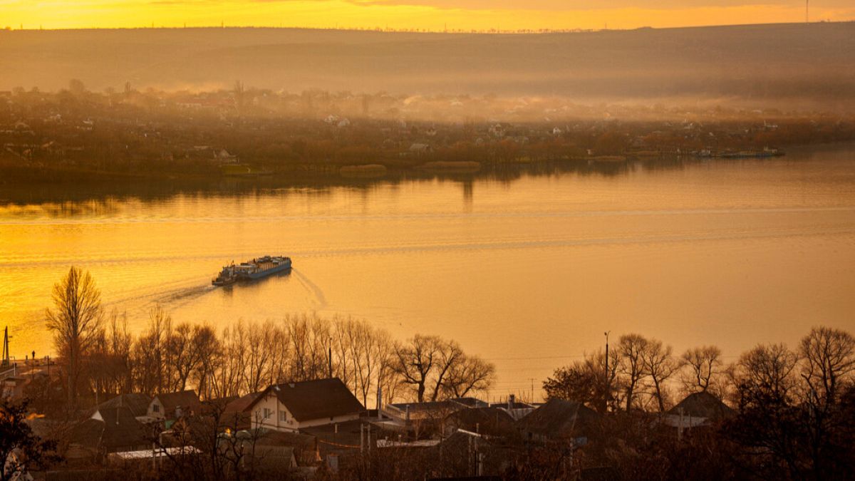 A ferry sails to the left bank of the Dniester river, the border between Moldova and Transnistria, seen from Molovata, Moldova, Wednesday, Jan. 8, 2025.