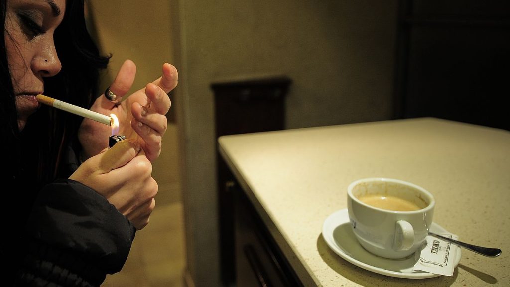 A woman smokes a cigarette in a bar in Pamplona, Spain, 2010.