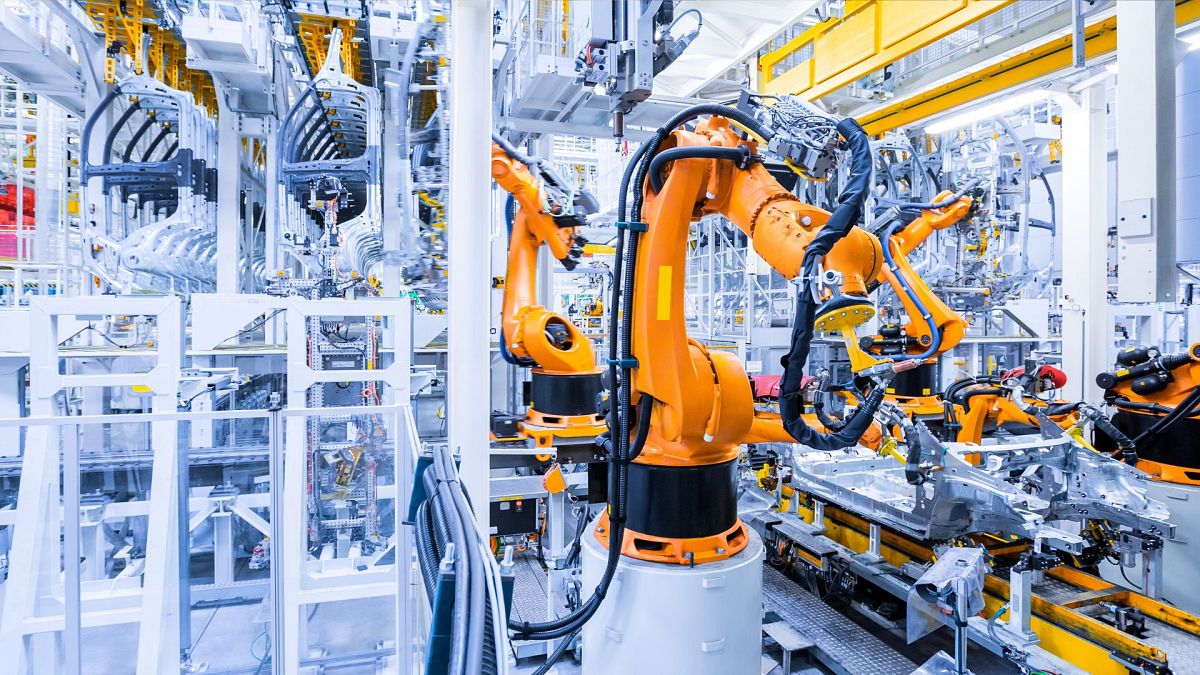 Robotic arms working in a car plant