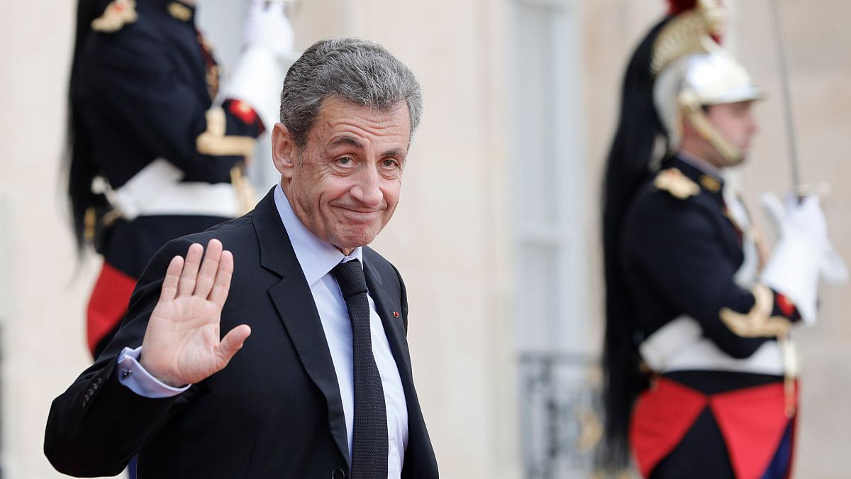 FILE - Former French President Nicolas Sarkozy leaves the Elysee Palace after a lunch with heads of states and officials, Monday, Sept. 30, 2019 in Paris.