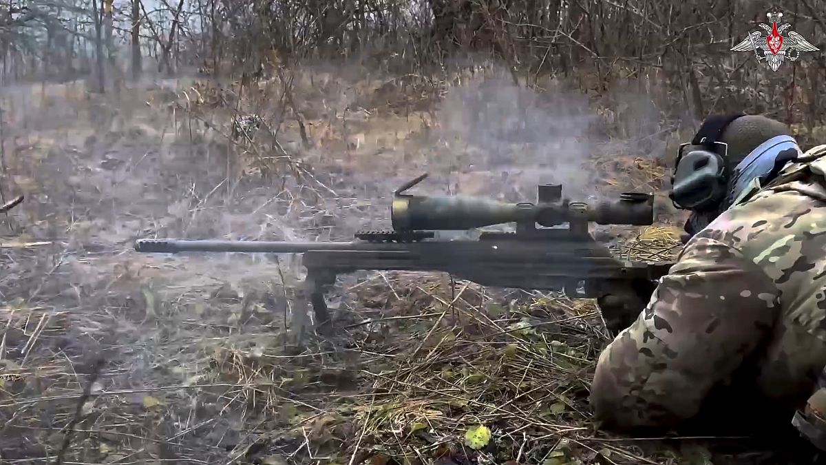 In this photo taken from video distributed by the Russian Defense Ministry Press Service on Saturday, Jan. 11, 2025, a Russian sniper fires towards Ukrainian forces.