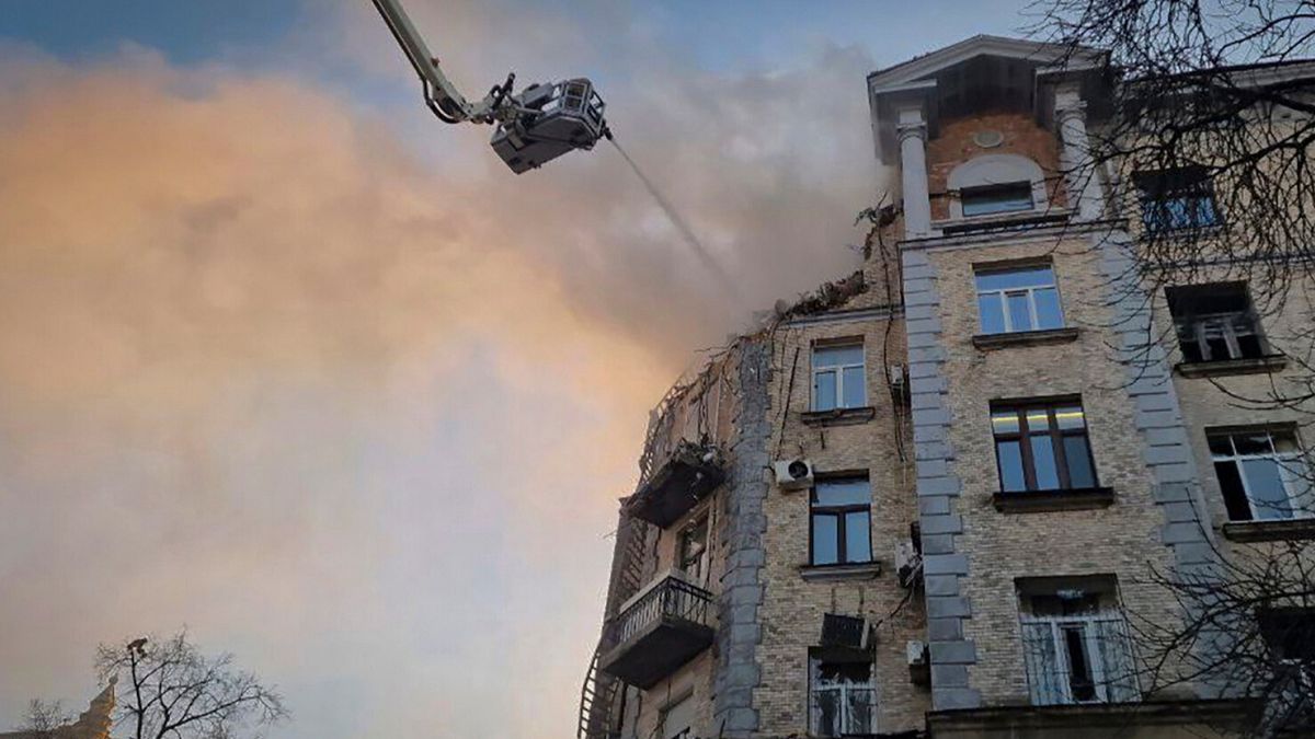 Firefighters put out the fire in a damaged building following a Russian drone attack, in Kyiv, Ukraine, Wednesday, Jan. 1 2025.