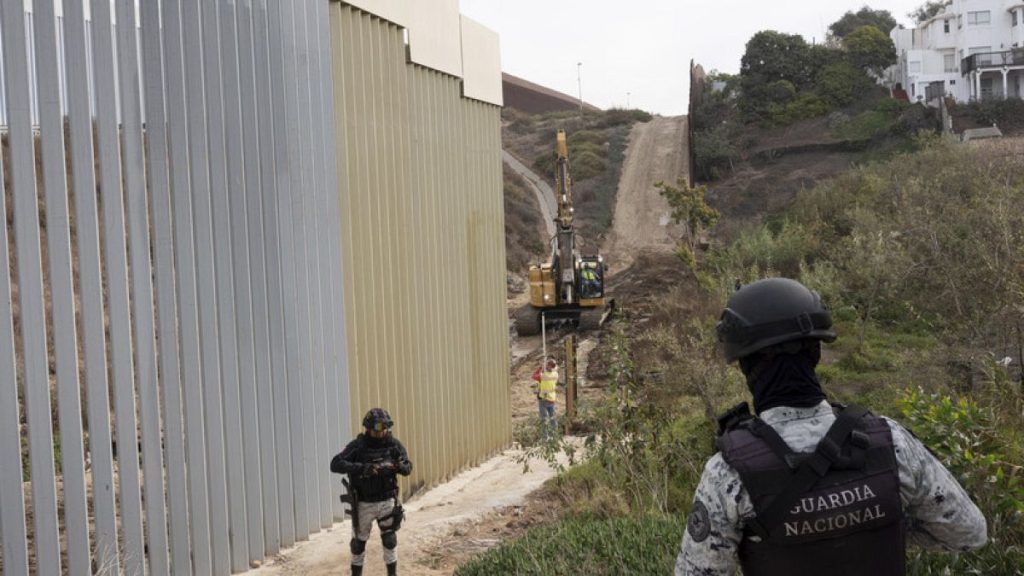 Members of the Mexican National Guard patrol as construction crews replace sections of one of two border walls separating Mexico from the United States, Jan 22, 2025