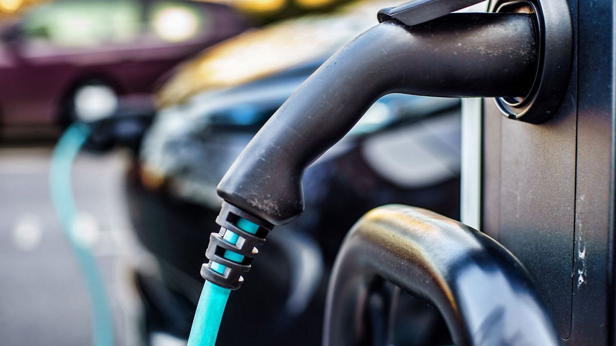 An electric vehicle being charged on a UK street