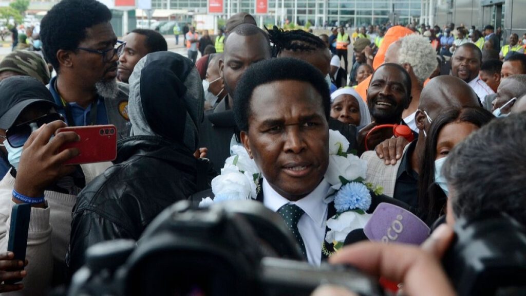 Mozambican opposition leader Venâncio Mondlane speaks to journalists on his arrival at Mavalane International Airport in Maputo.