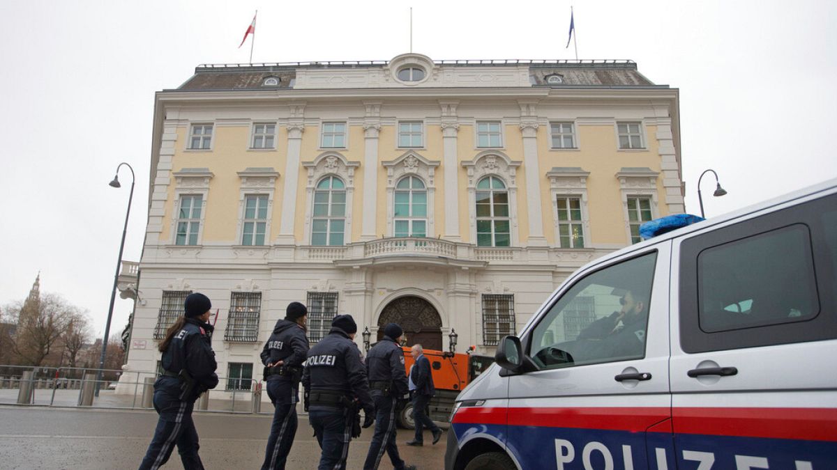 Police officers walk outside of the chancellery in Vienna, Austria, Tuesday, Jan 7, 2025.