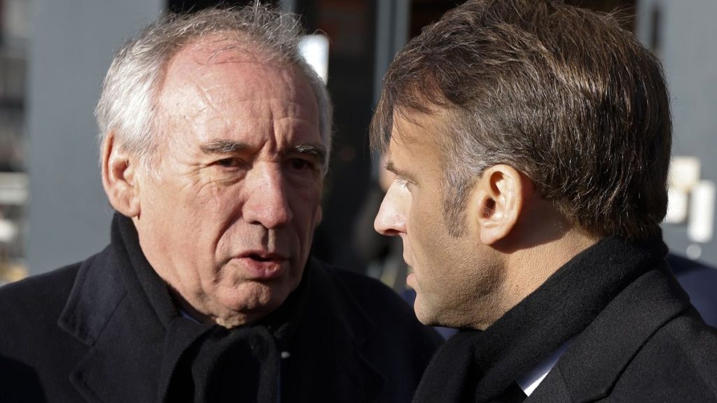 Prime Minister Francois Bayrou (left) talking to French President Emmanuel Macron, right