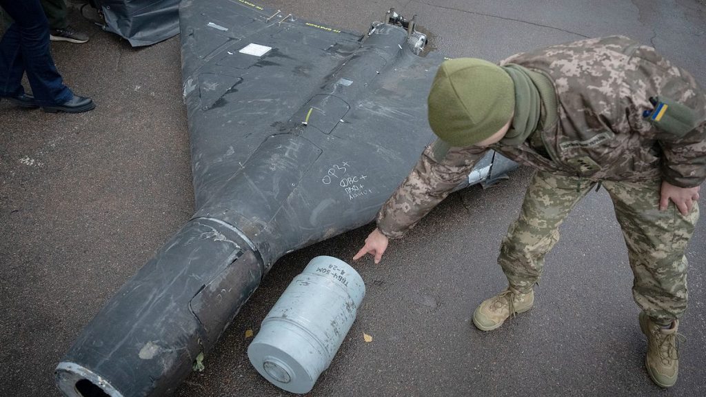 FILE: A Ukrainian officer shows a thermobaric charge of a downed Shahed drone launched by Russia in an undisclosed location in Ukraine, 14 November 2024