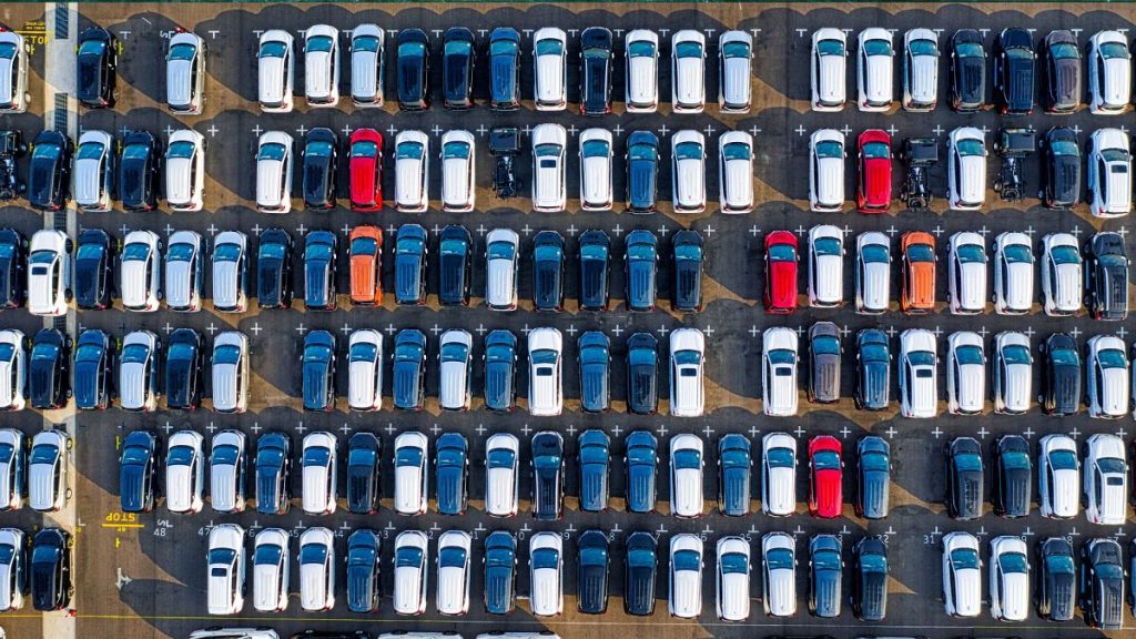 Rows of parked cars in a parking lot