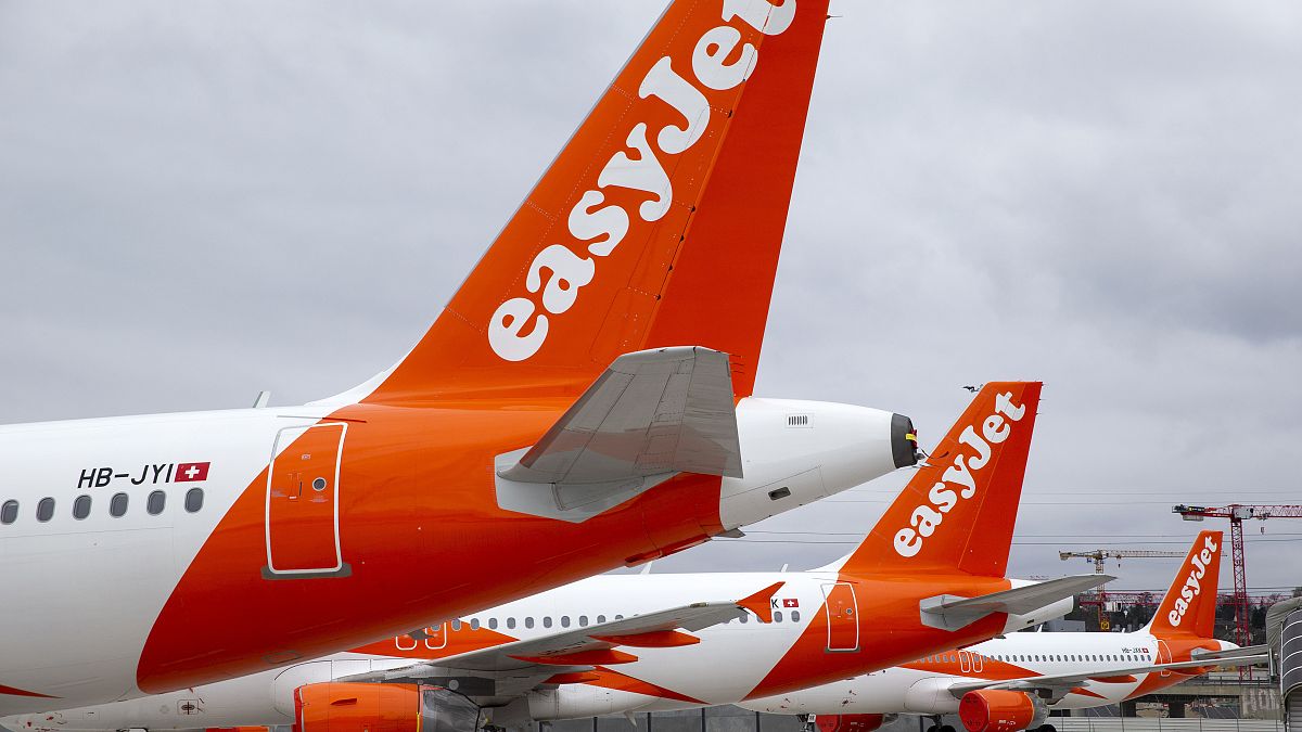 A large number of easyJet aircrafts are parked on the tarmac of the Geneve Aeroport, in Geneva, Switzerland, Monday, March 30, 2020.