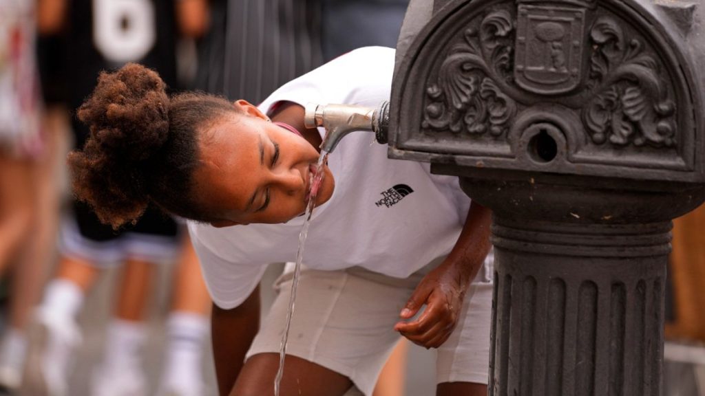 FILE - A girl drinks water from a public fountain tap, 2023.