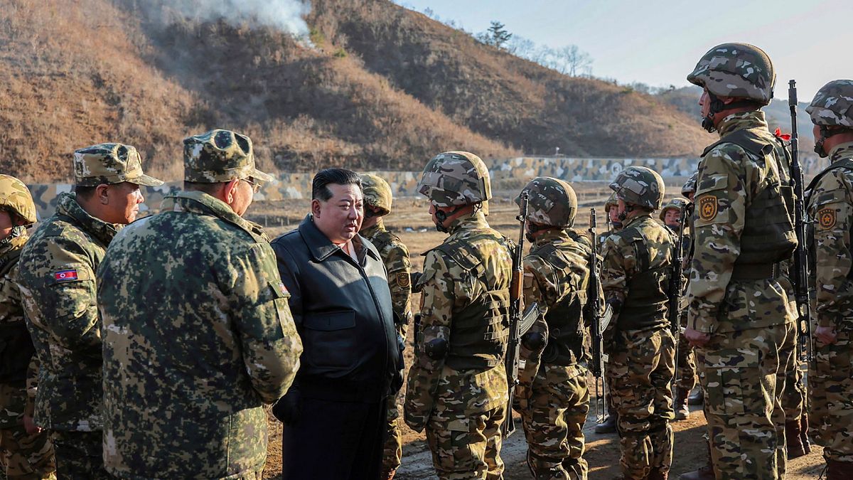 FILE - In this photo provided by the North Korean government, North Korean leader Kim Jong-un meets soldiers during a visit to a western operational training base, 6 Mar 2024