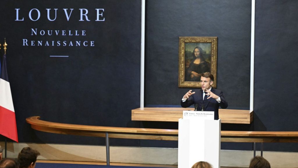 French President Emmanuel Macron gives a speech to announce a multi-year overhaul, long-term investments to modernize the Louvre museum