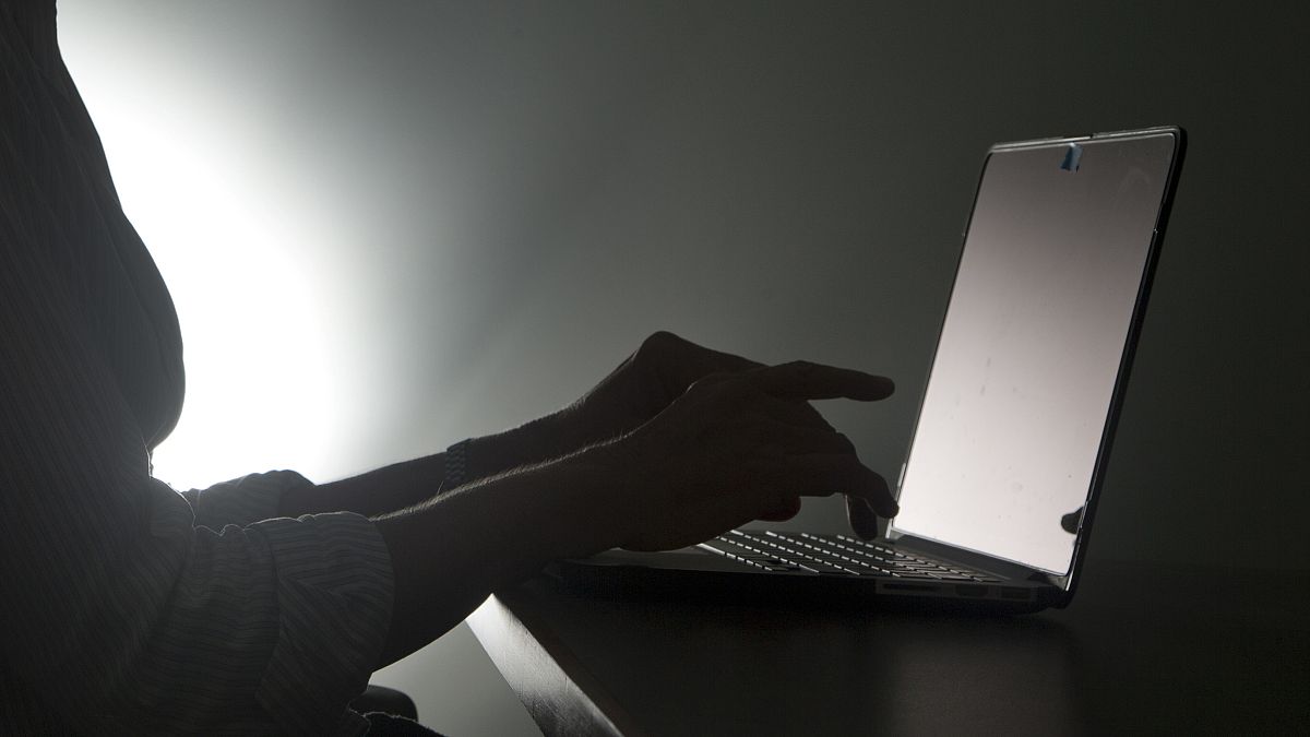 In this, Monday, Dec. 12, 2016, file photo illustration, a person types on a laptop, in Miami.