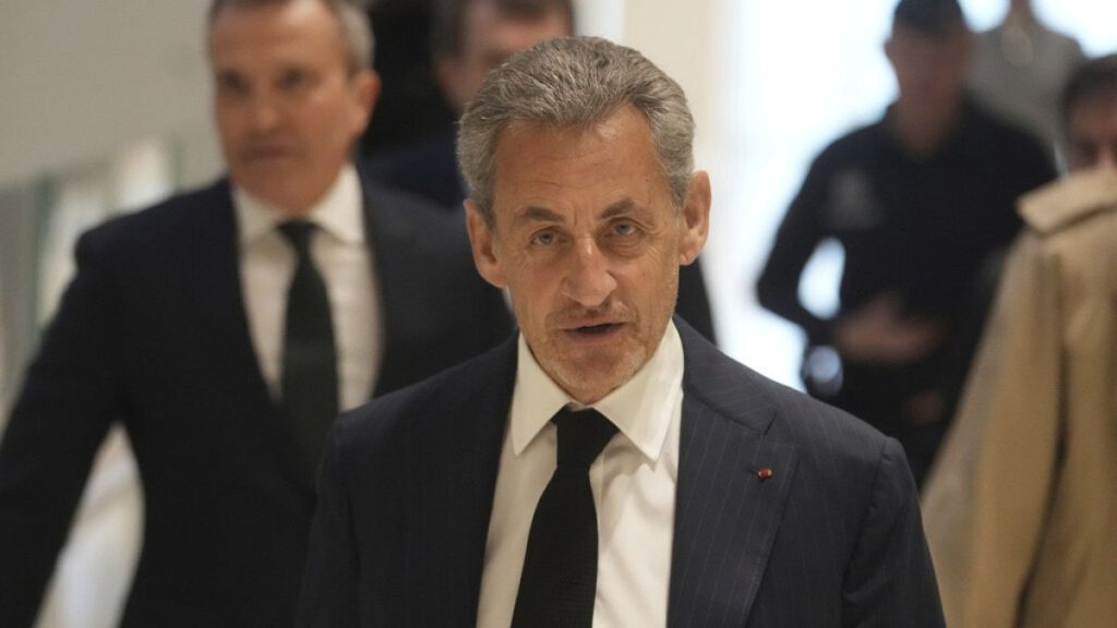 Former French President Nicolas Sarkozy arrives as he goes on trial over alleged illegal financing of his 2007 presidential campaign, Jan. 6, 2025 in Paris