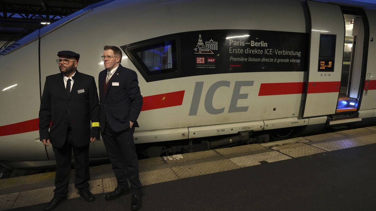 Employees stand by the first Paris-Berlin high speed train line that will operate Monday, Dec. 16, 2024 at the Gare de l