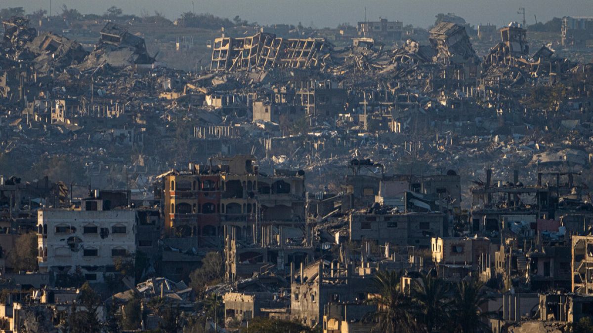 Destroyed buildings are seen inside the Gaza Strip from southern Israel, Monday, Jan. 13, 2025.