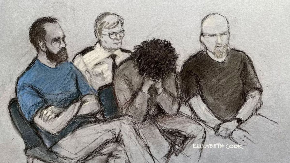 Court artist drawing by Elizabeth Cook shows 17-year-old Axel Rudakubana, centre, covering his face in the dock at Liverpool Crown Court in Liverpool - 1 Aug 2024