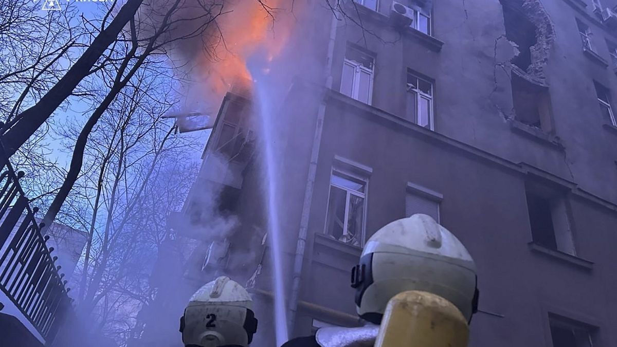 Ukranian fire fighters trying to put up a fire in a resident