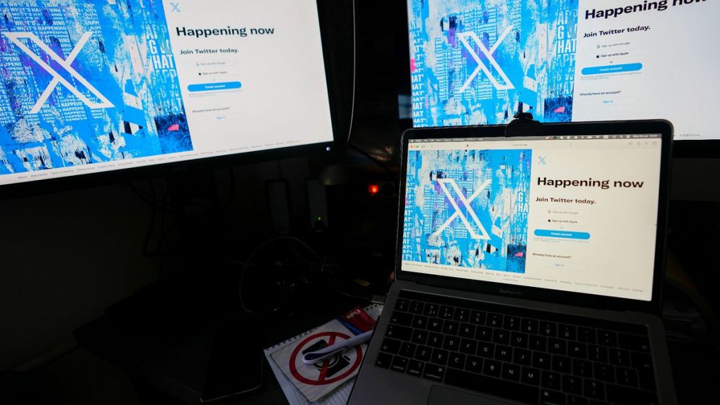 Computer monitors and a laptop display the X, formerly known as Twitter, sign-in page, July 24, 2023, in Belgrade, Serbia