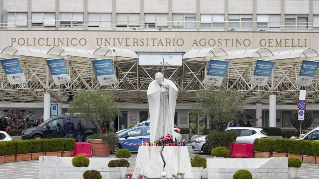 A statue of Pope John Paul II is seen in front of the Agostino Gemelli Polyclinic, in Rome, Tuesday, Feb. 18, 2025, where Pope Francis has been hospitalised.