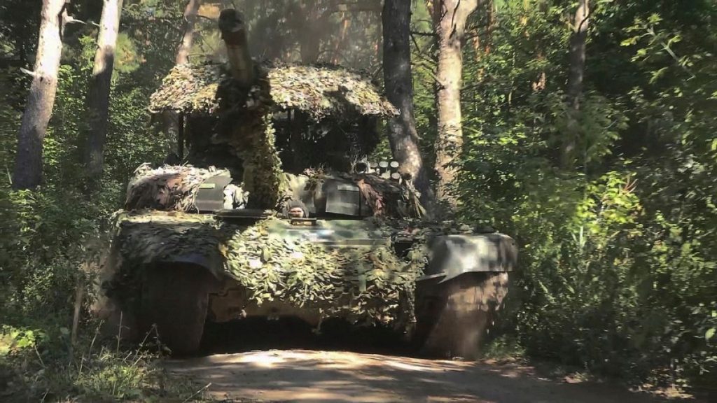 FILE - In this photo taken from a video released by the Russian Defense Ministry on Aug. 17, 2024, a Russian T-72B3M tank is seen at an undisclosed location.