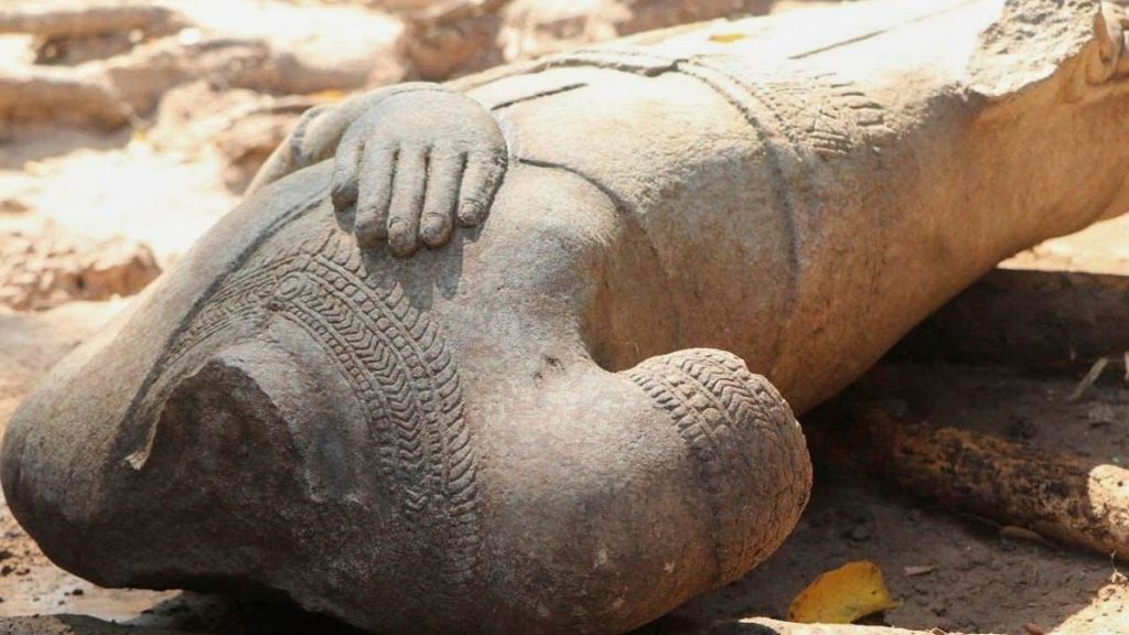 Headless statue excavated by archaeologists at the Angkor temple complex in Cambodia