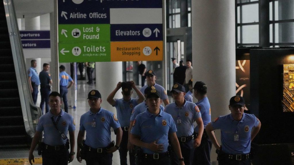 Security officers patrol the airport after former President Rodrigo Duterte was arrested, in Manila, Philippines, Tuesday, March 11, 2025.