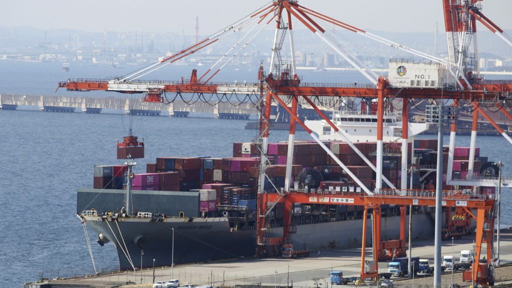 A container ship is loaded and unloaded at a container terminal at a port of Kawasaki near Tokyo. 9 March 2022.