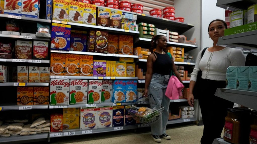 Shoppers buy food in a supermarket in London in August 2022.